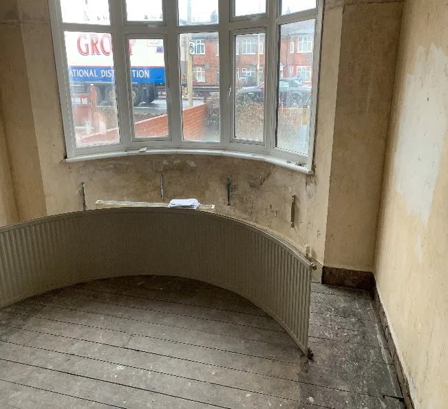 damp damage behind radiator